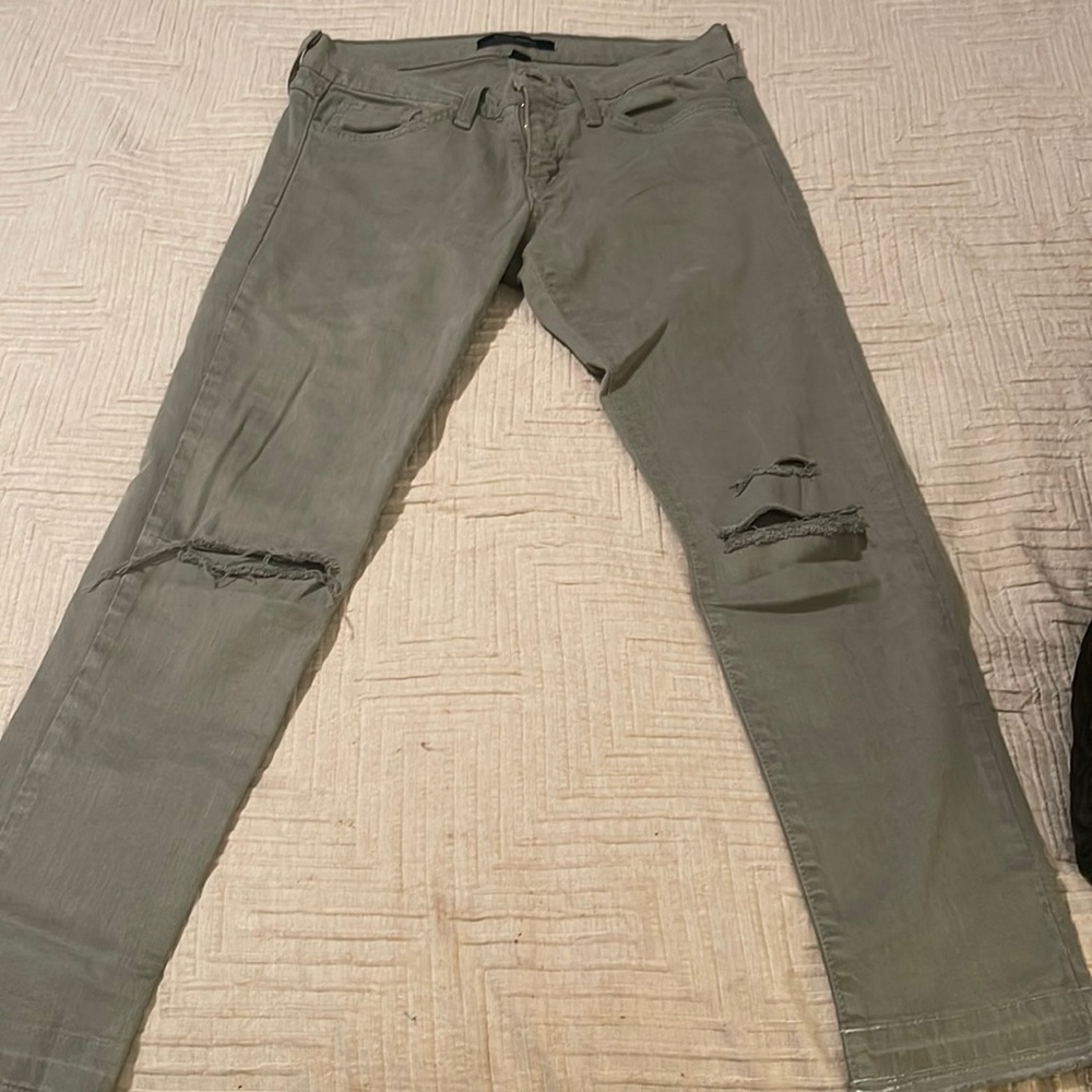 Flying Monkey jeans. Ripped at the knee and frayed at the bottom. Size 26W.